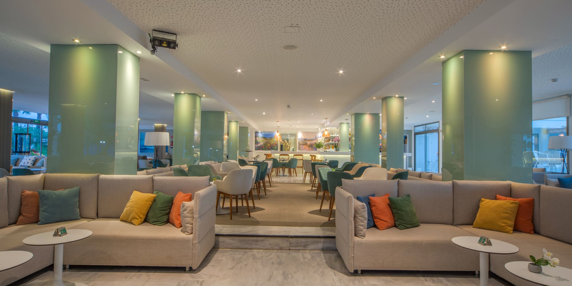 a room with couches and tables