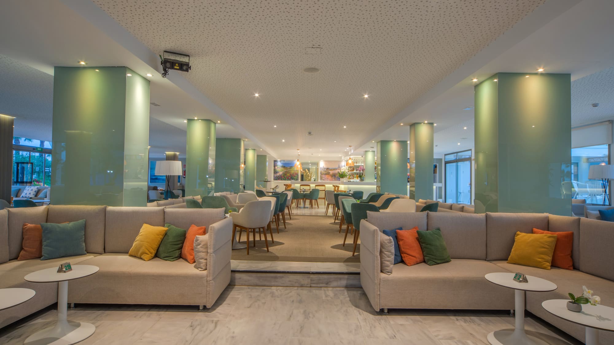 a room with couches and tables