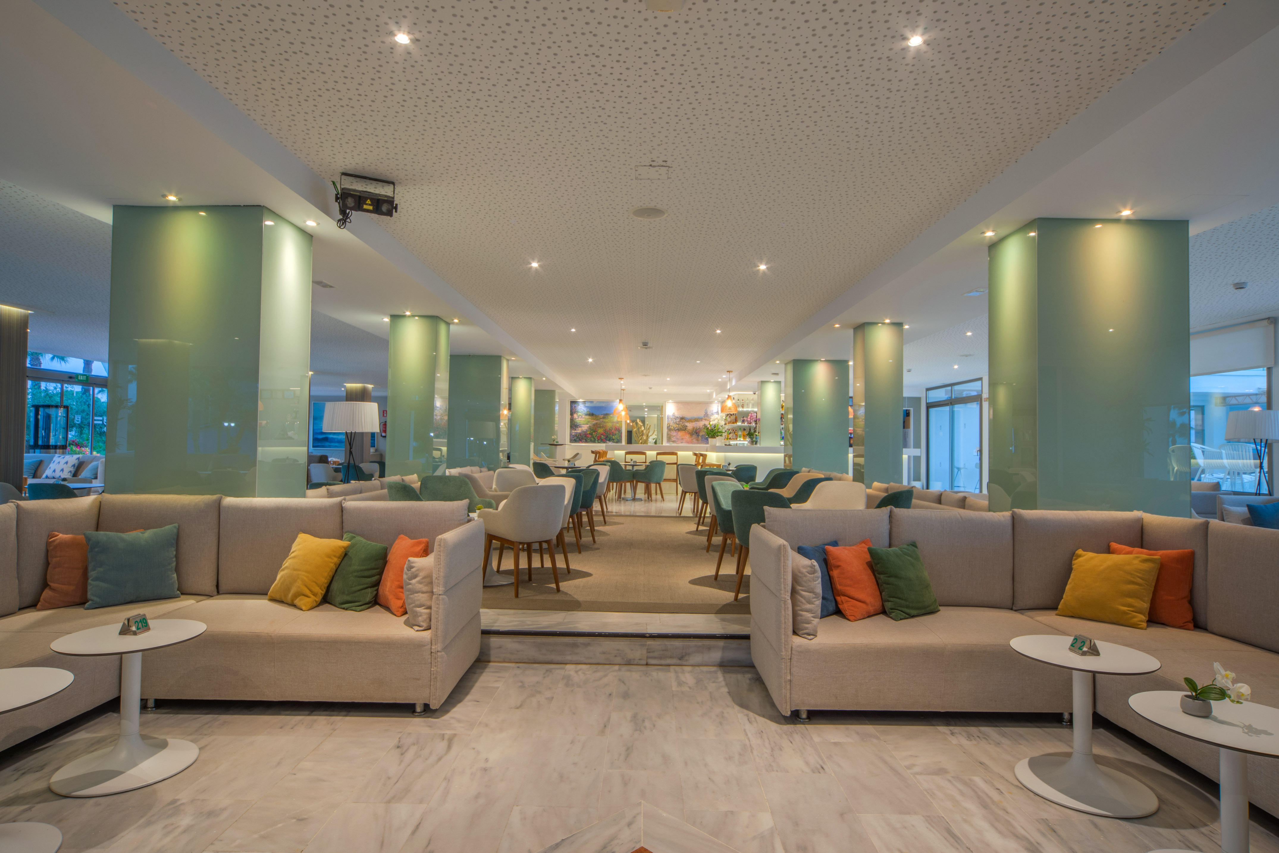 a room with couches and tables