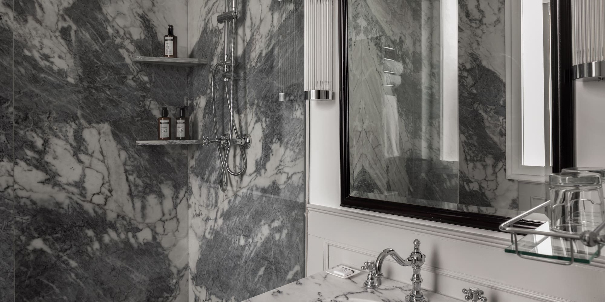 a bathroom with a mirror and sink