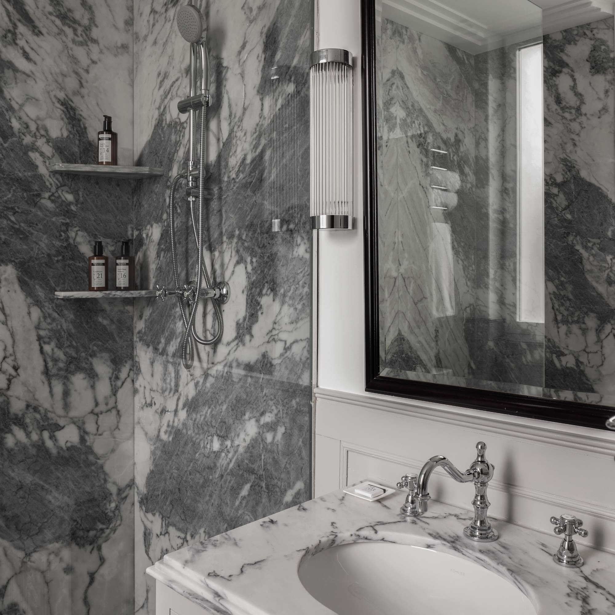 a bathroom with a mirror and sink