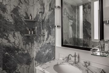 a bathroom with a mirror and sink