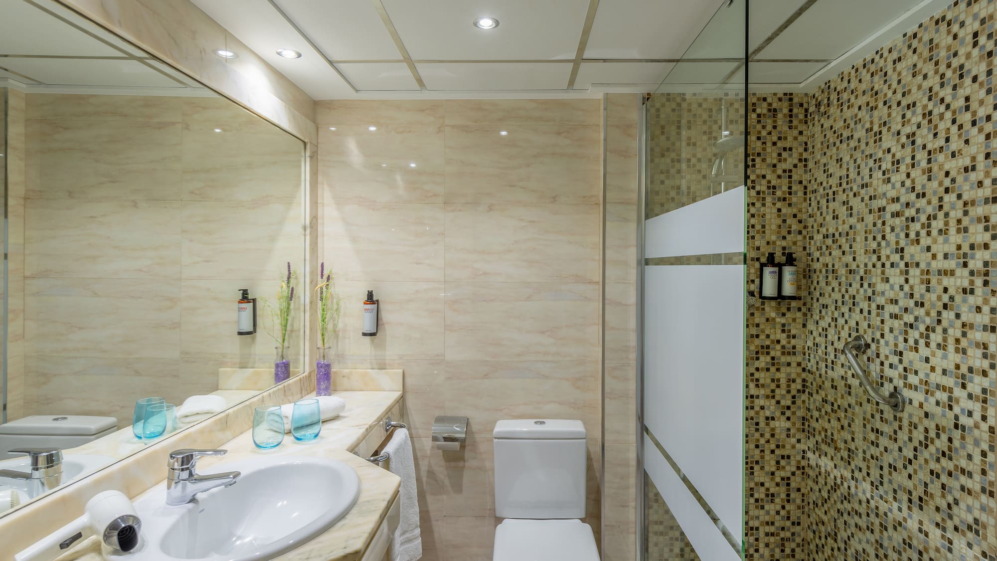 a bathroom with a shower and sink