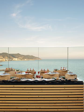 a table with food on it by the water