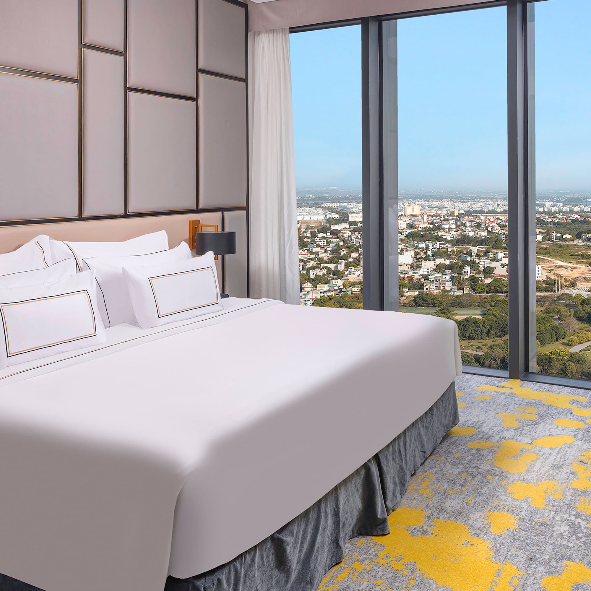 a bed with a view of a city