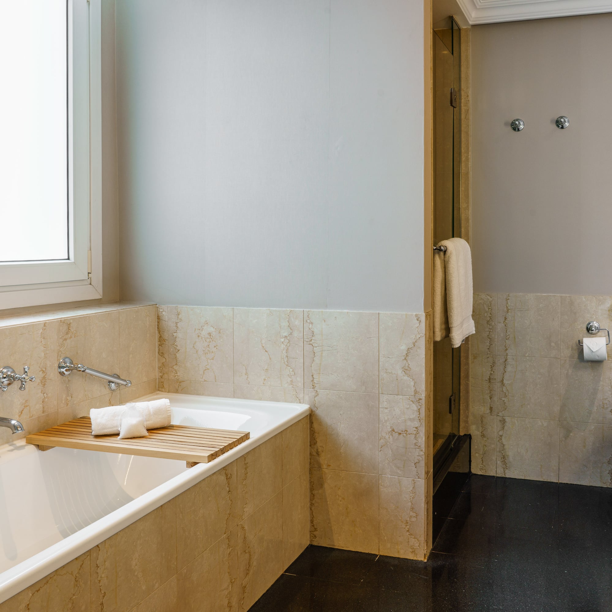 a bathroom with a bathtub and a toilet