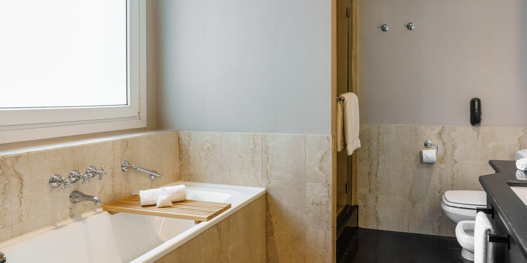 a bathroom with a bathtub and a toilet