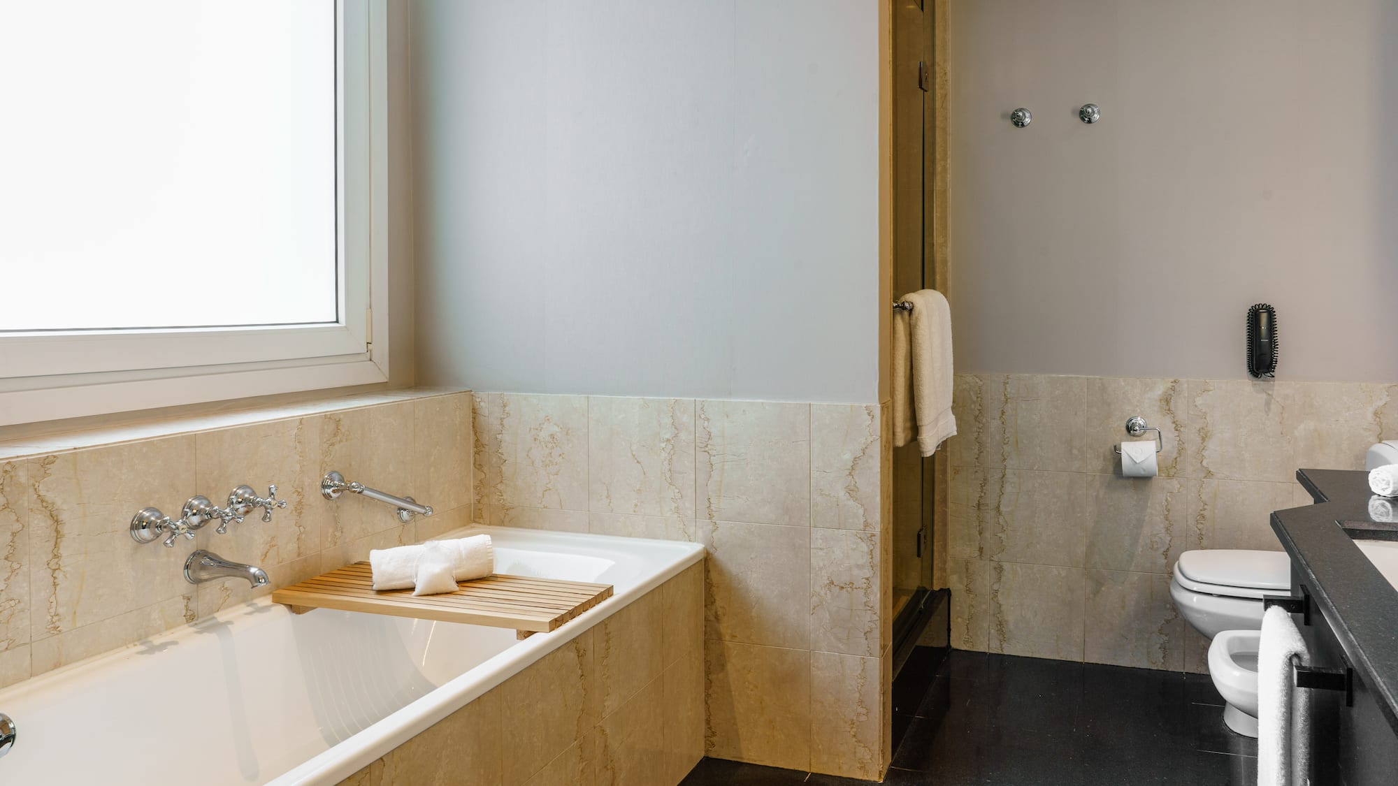 a bathroom with a bathtub and a toilet