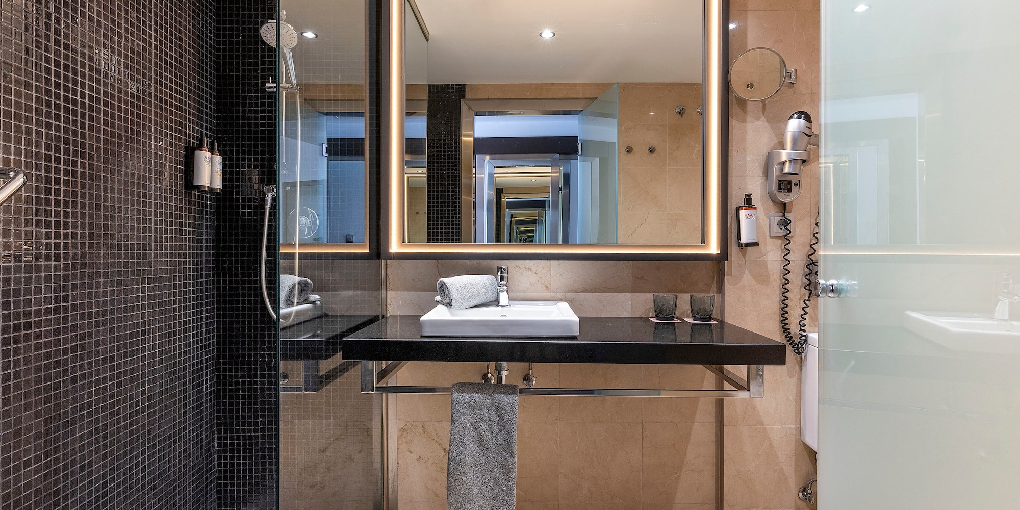 a bathroom with a mirror and sink