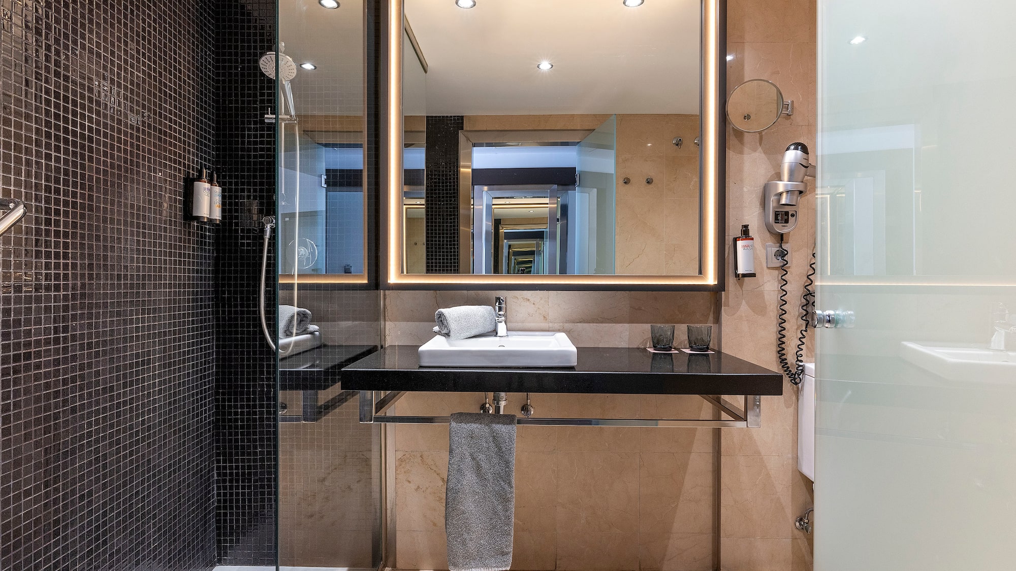 a bathroom with a mirror and sink