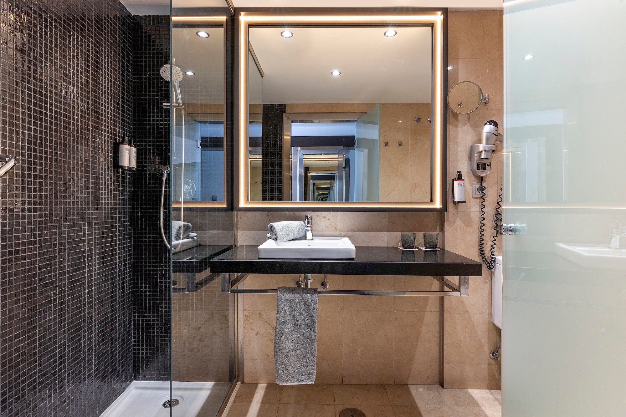 a bathroom with a mirror and sink
