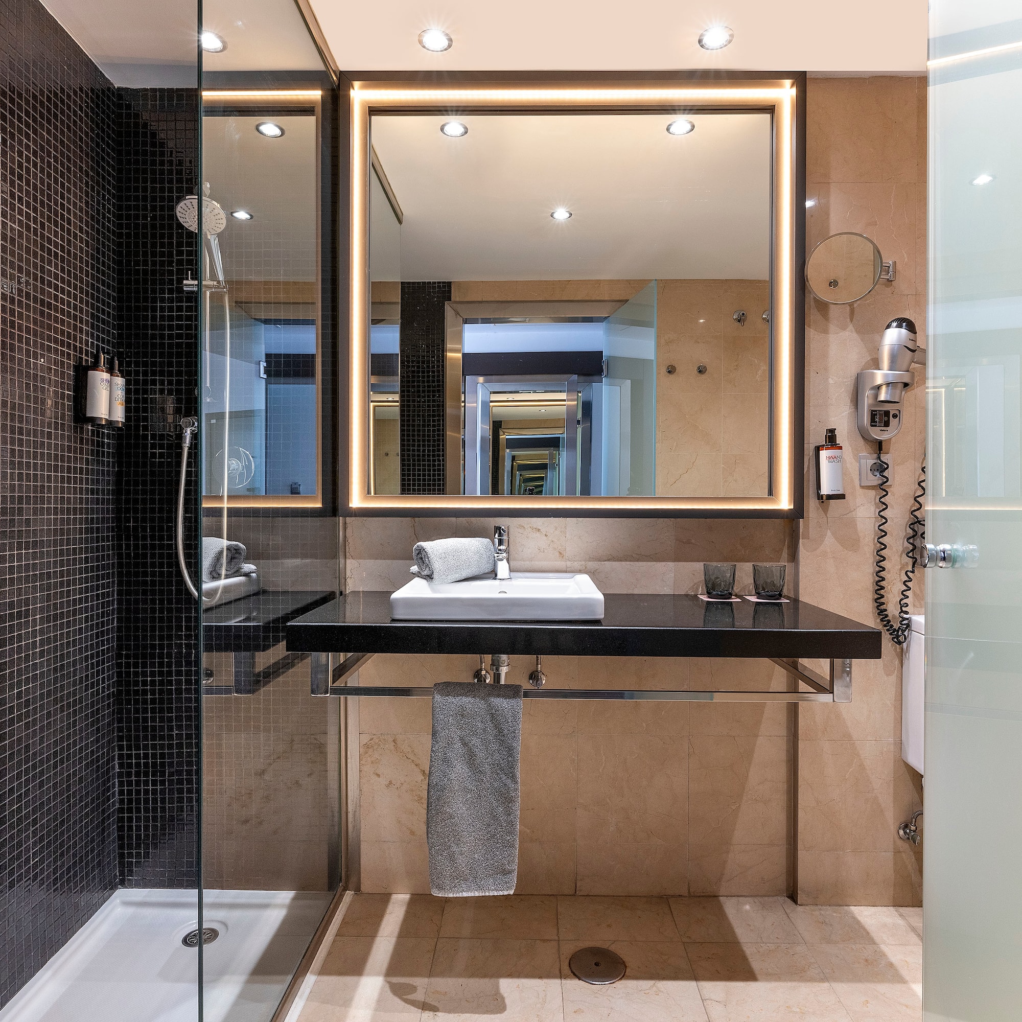 a bathroom with a mirror and sink