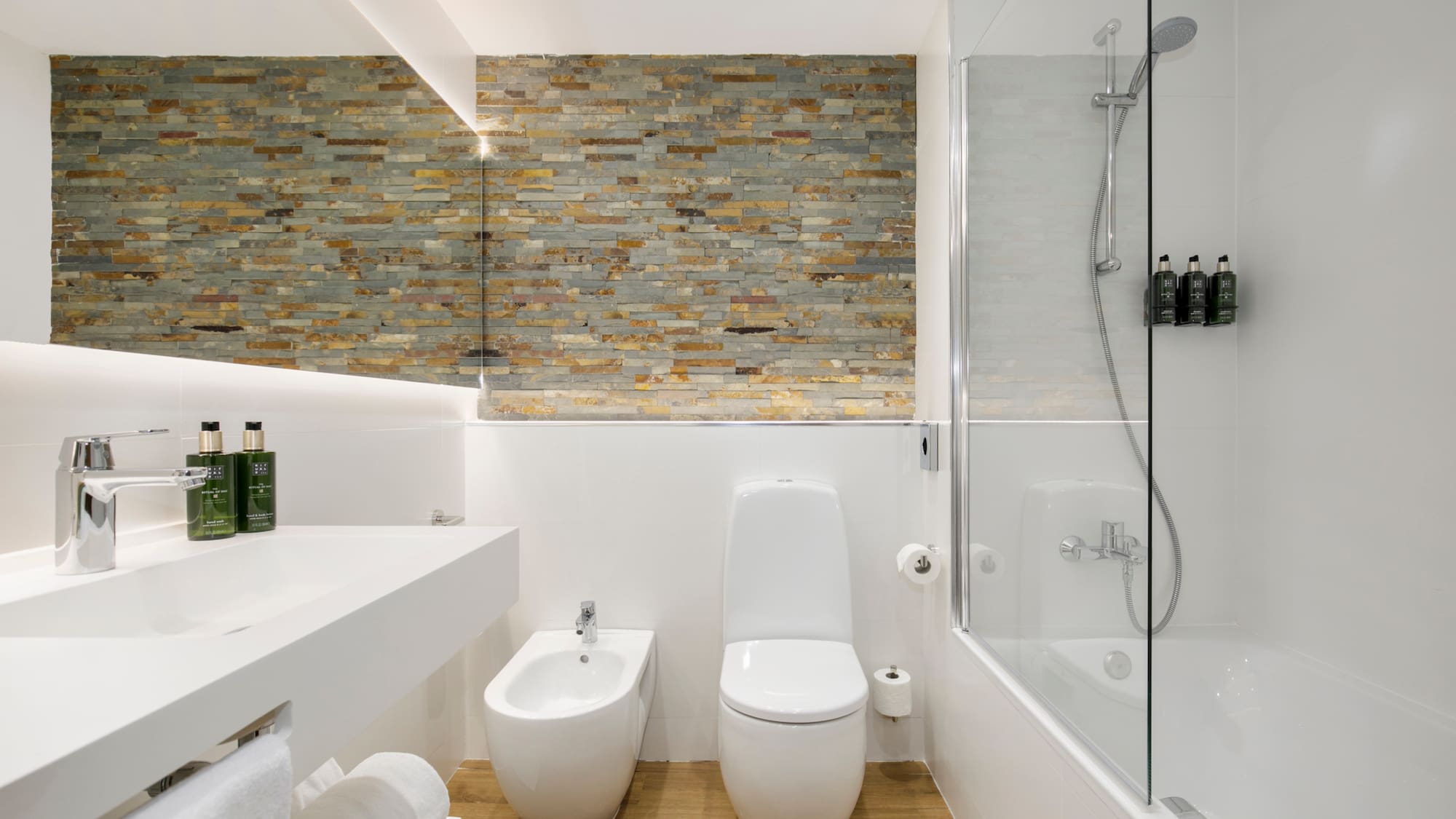 a bathroom with a shower and toilet