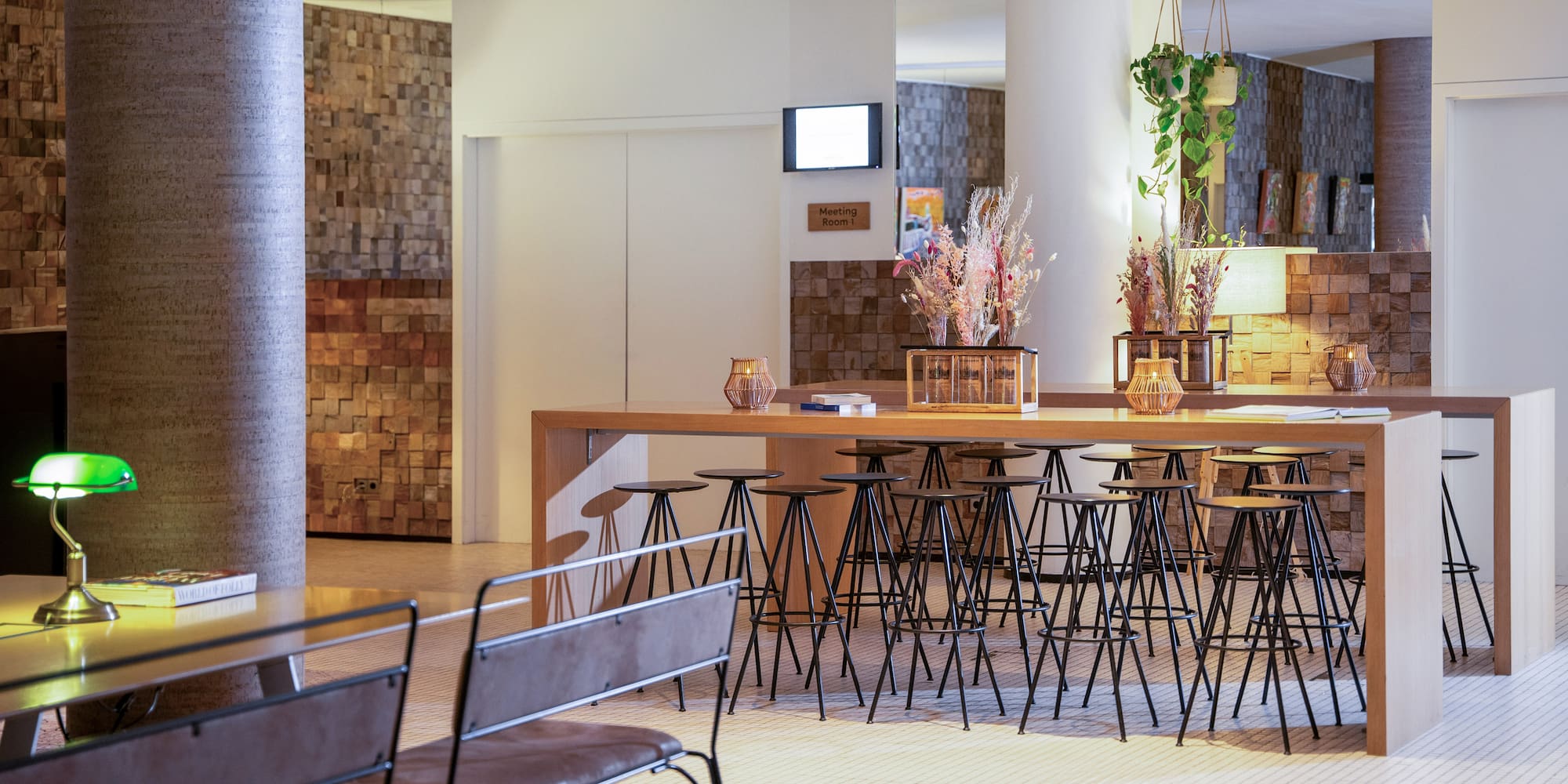 a room with a bar and chairs