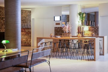 a room with a bar and chairs
