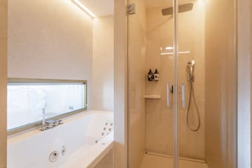a shower and bathtub in a bathroom