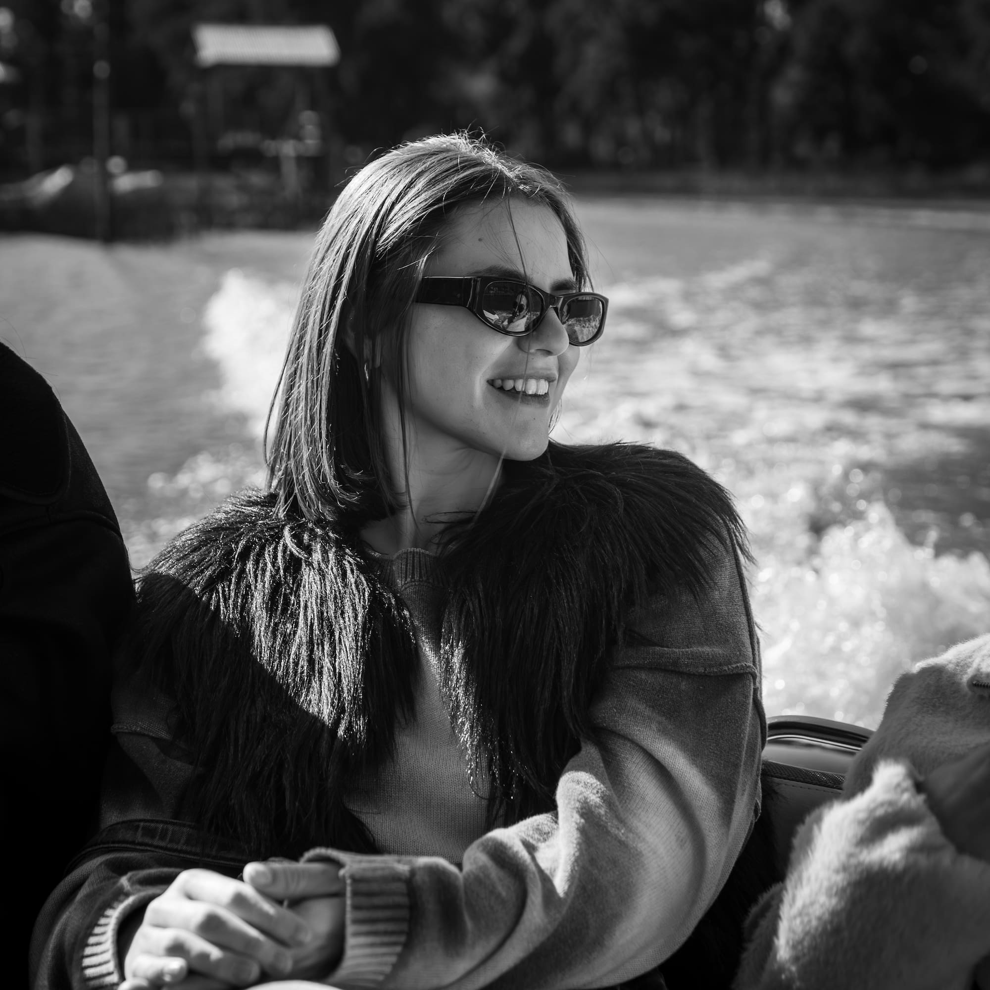 a woman in sunglasses on a boat