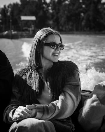 a woman in sunglasses on a boat