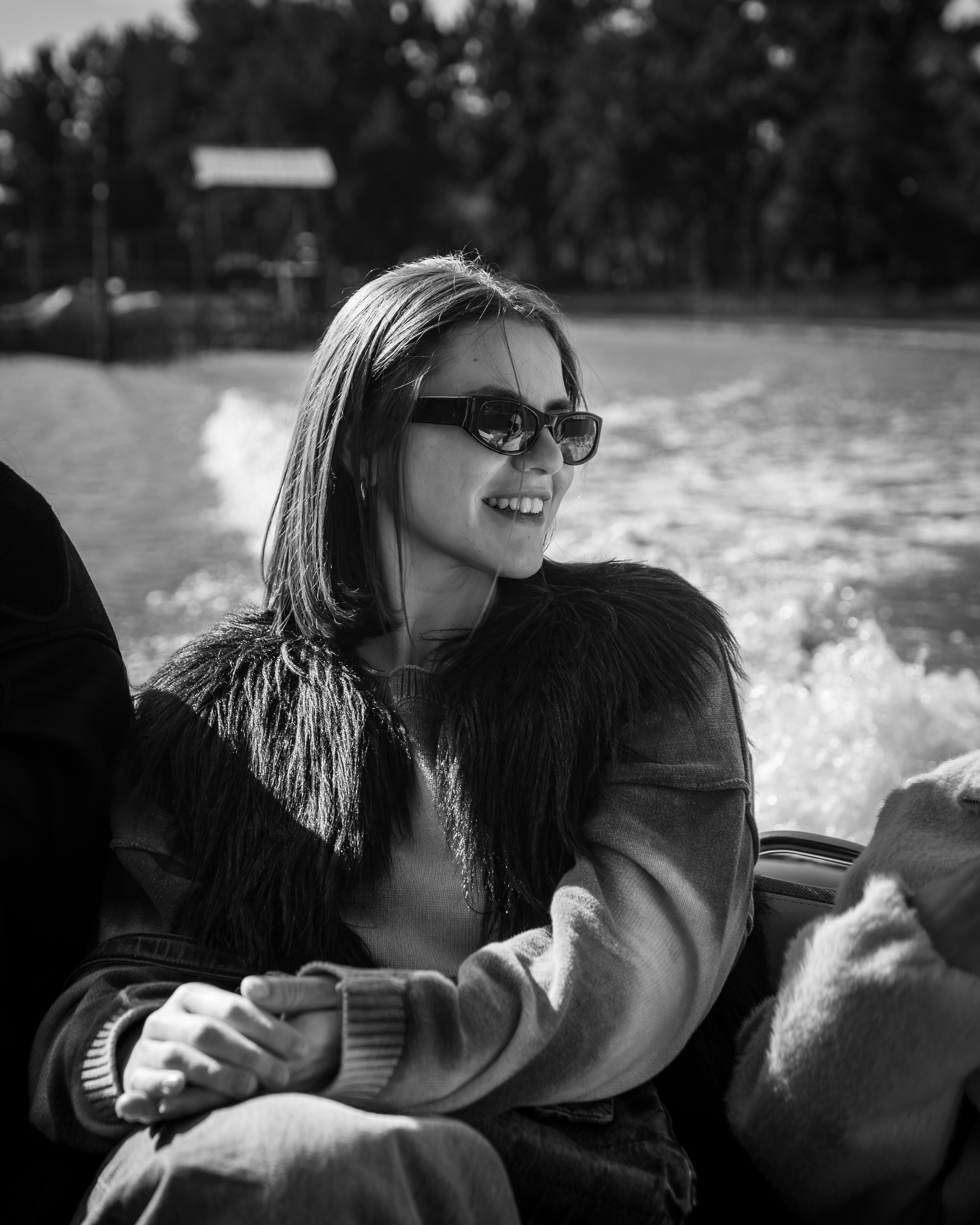 a woman in sunglasses on a boat