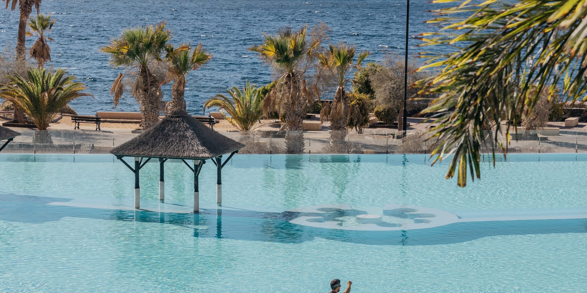 two men on paddle boards in a pool