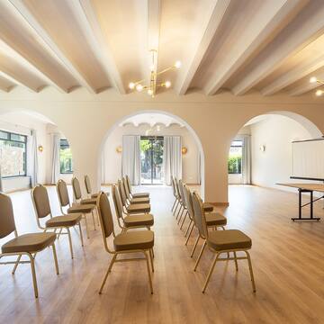 a room with chairs and a stage