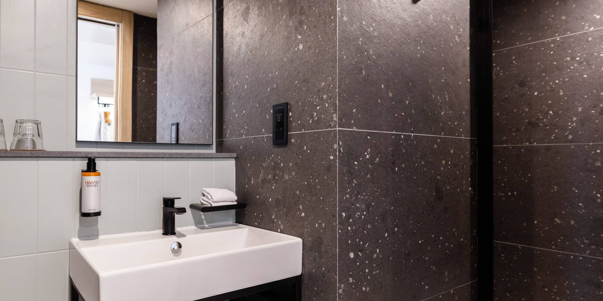 a bathroom with a sink and shower