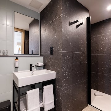 a bathroom with a sink and shower