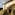 Couple in elaborate Renaissance costumes descending grand villa stairs.