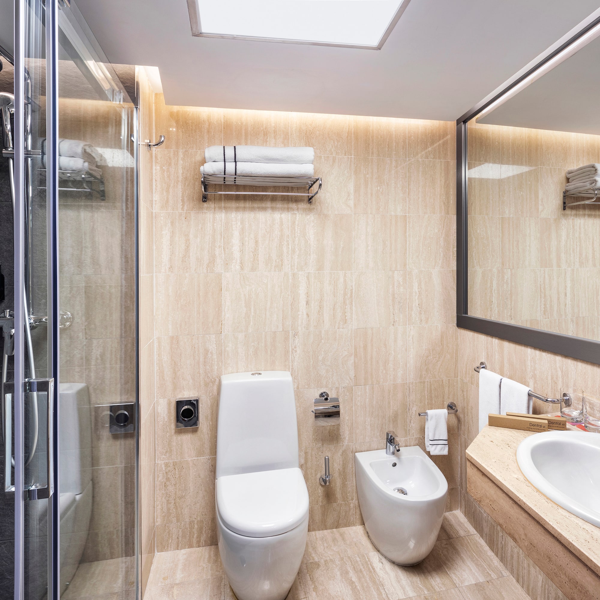 a bathroom with a shower and toilet