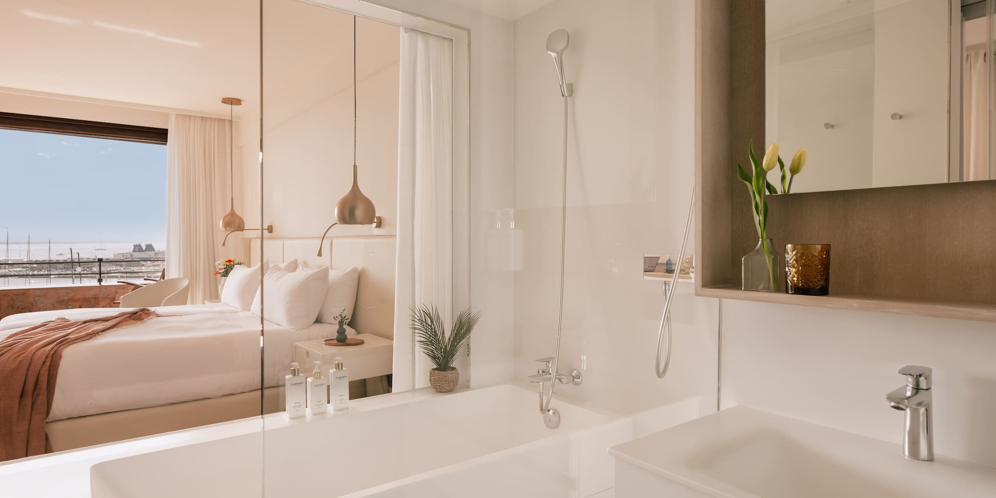 a bathroom with a bathtub and a bed