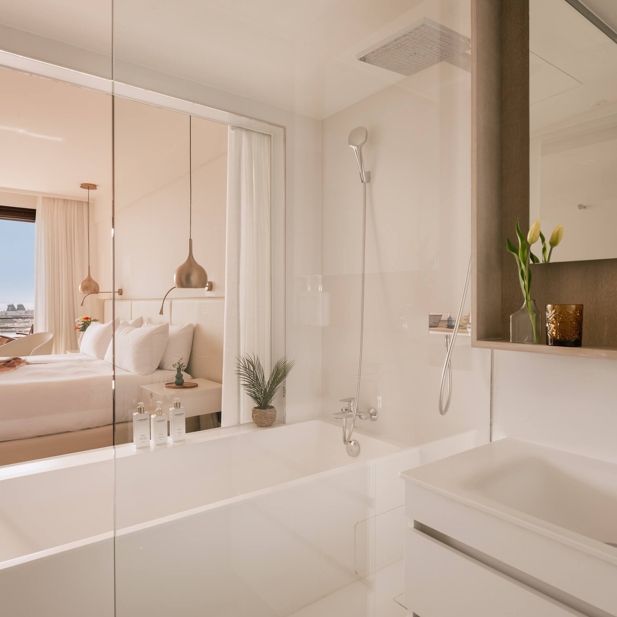 a bathroom with a bathtub and a bed