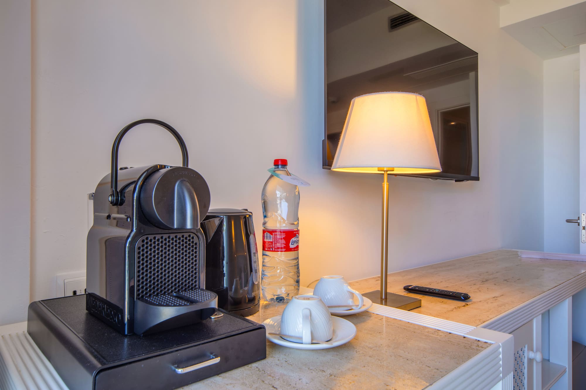 a coffee machine and a lamp on a counter
