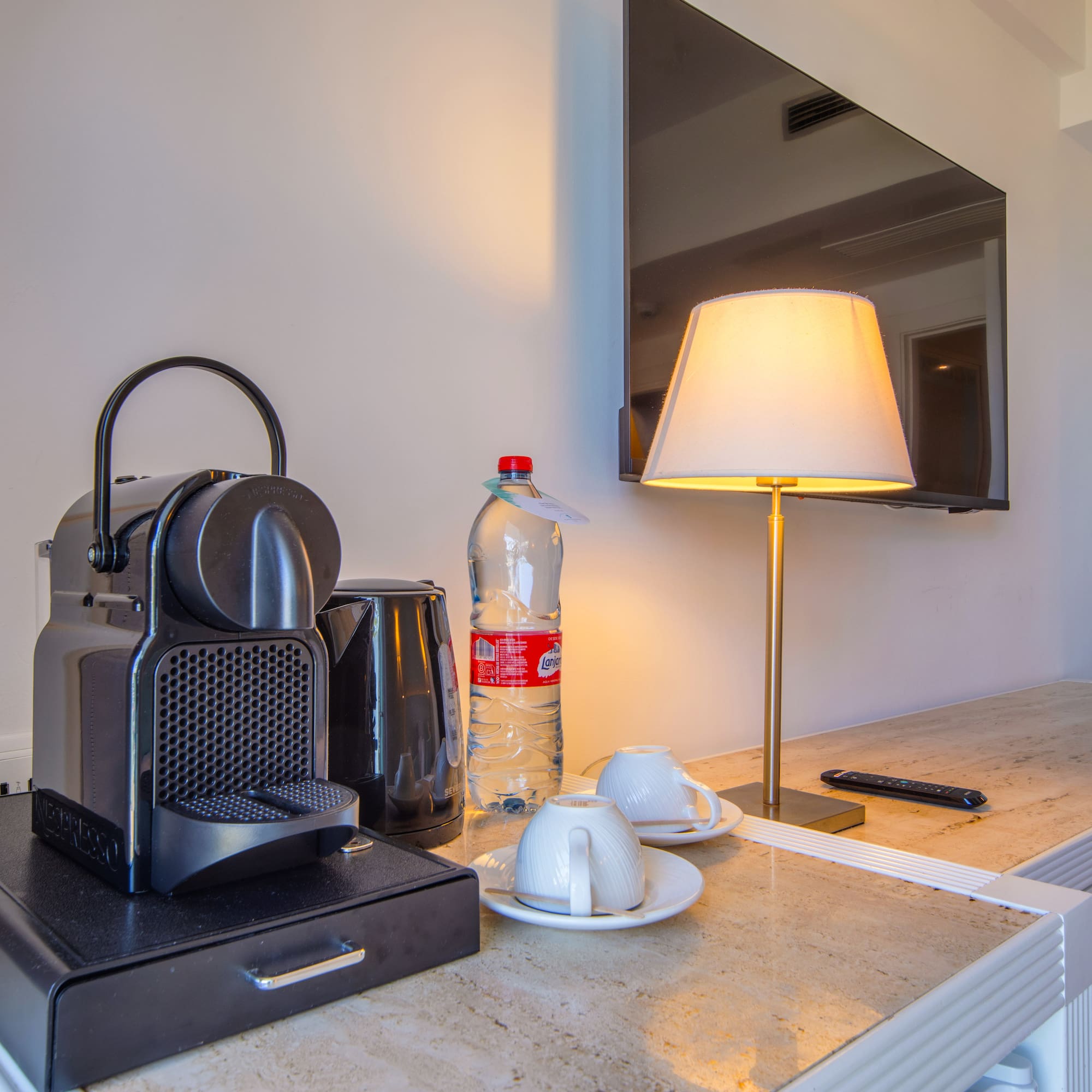 a coffee machine and a lamp on a counter