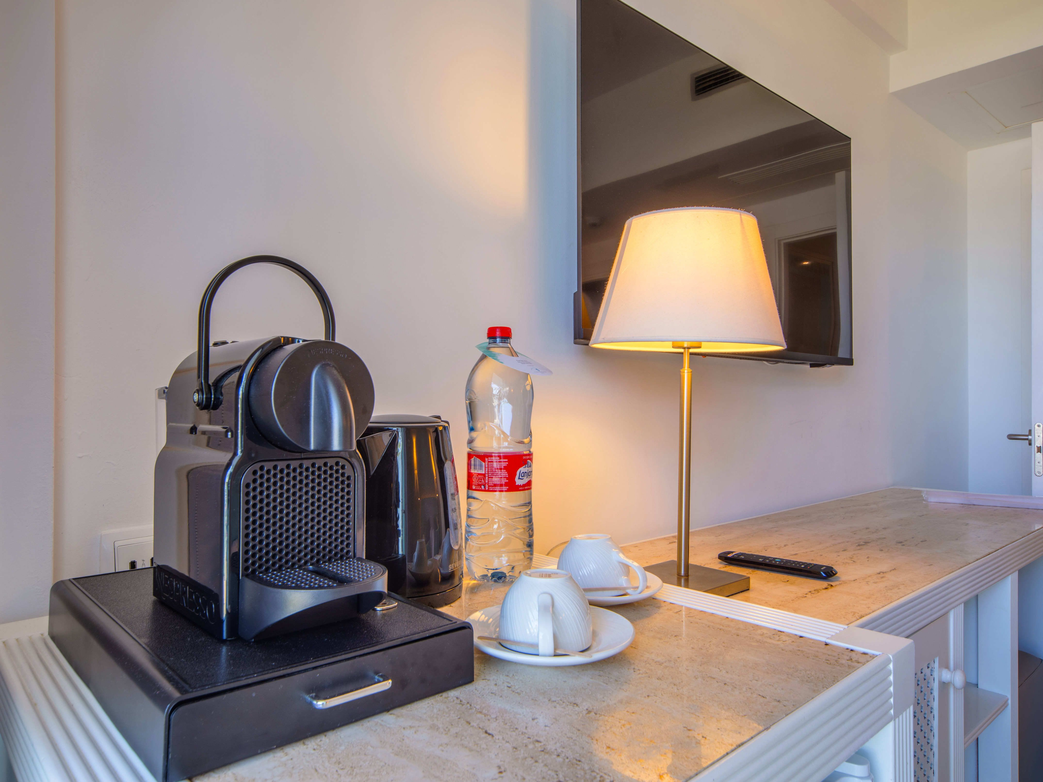 a coffee machine and a lamp on a counter