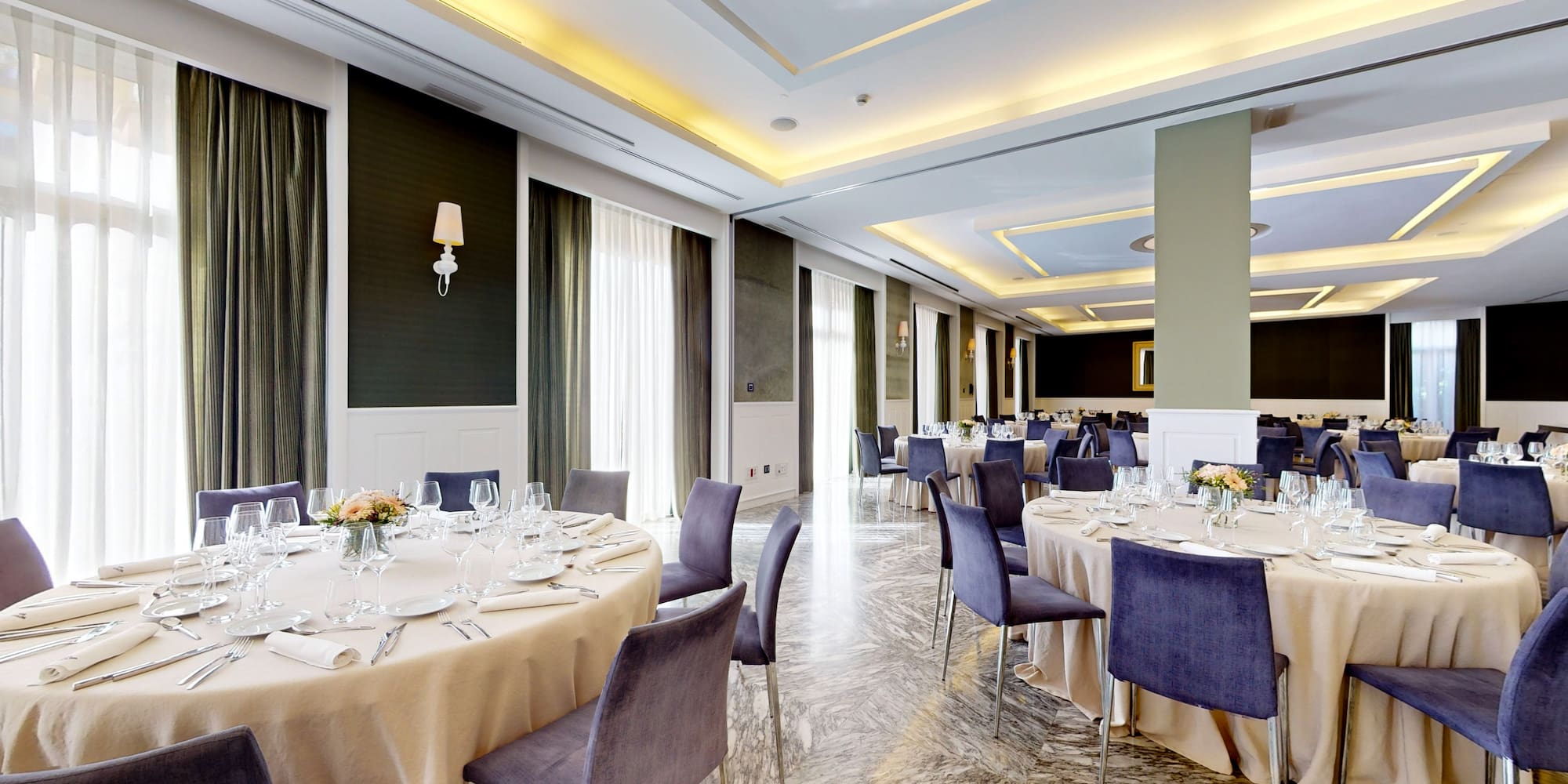 a room with tables and chairs