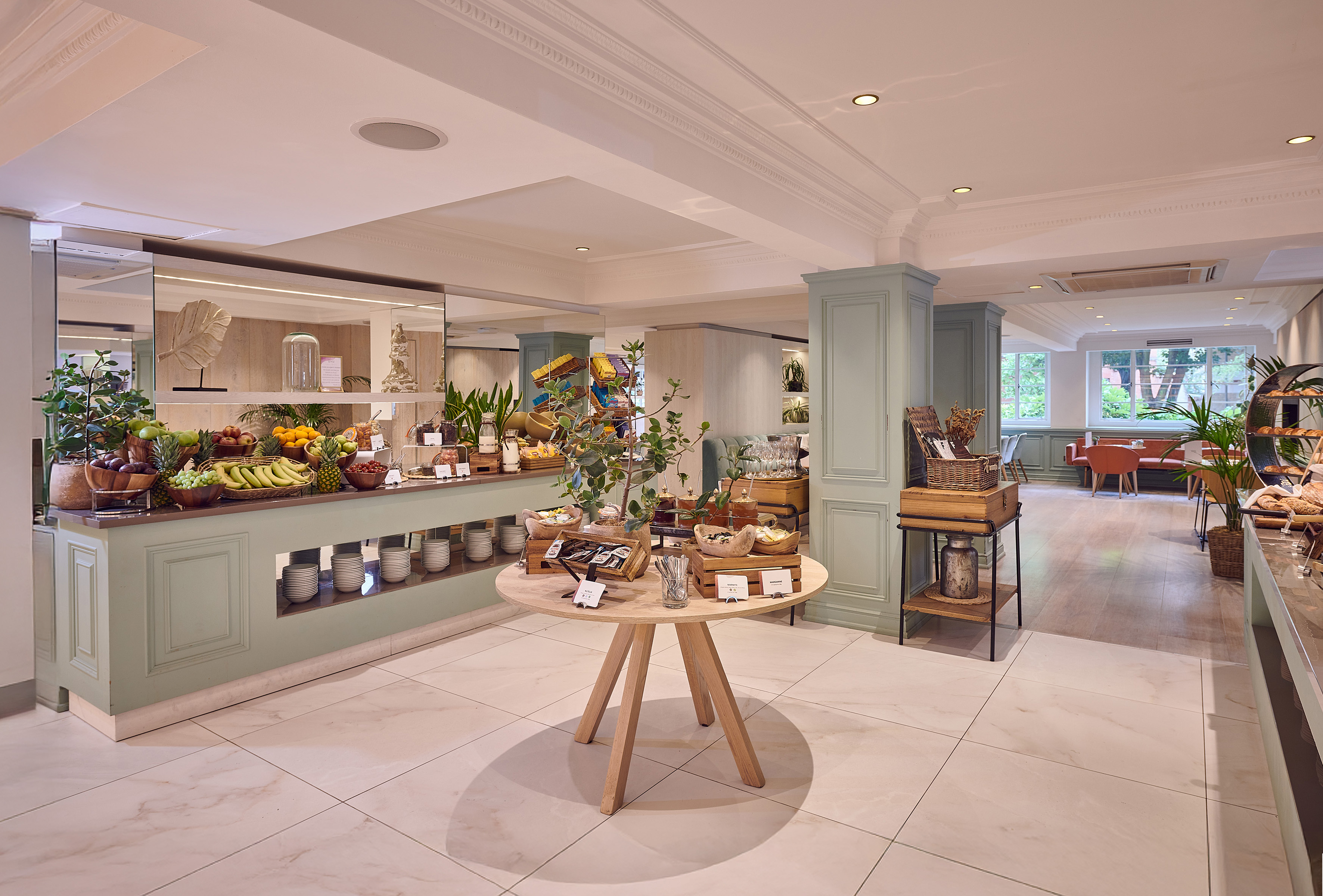 a room with a table and shelves of food