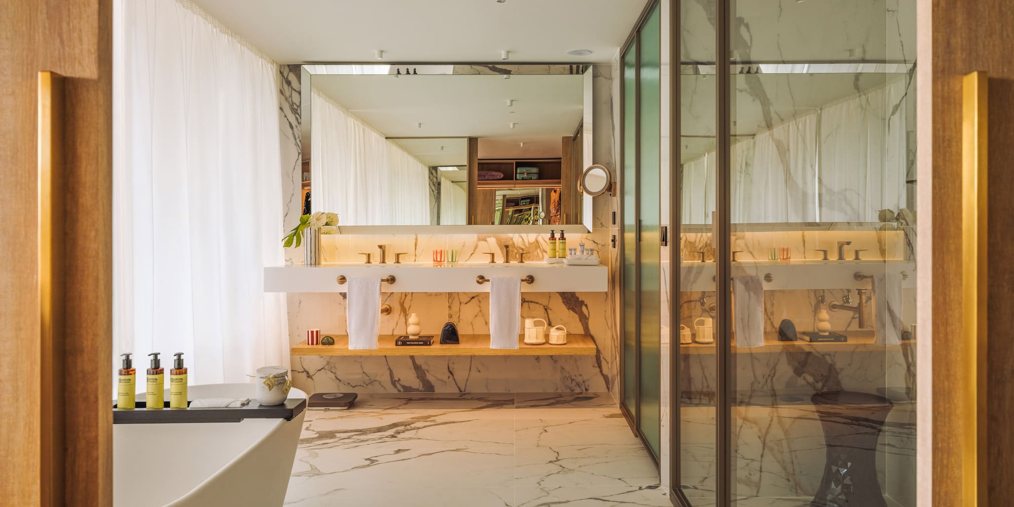a bathroom with a tub and a shower