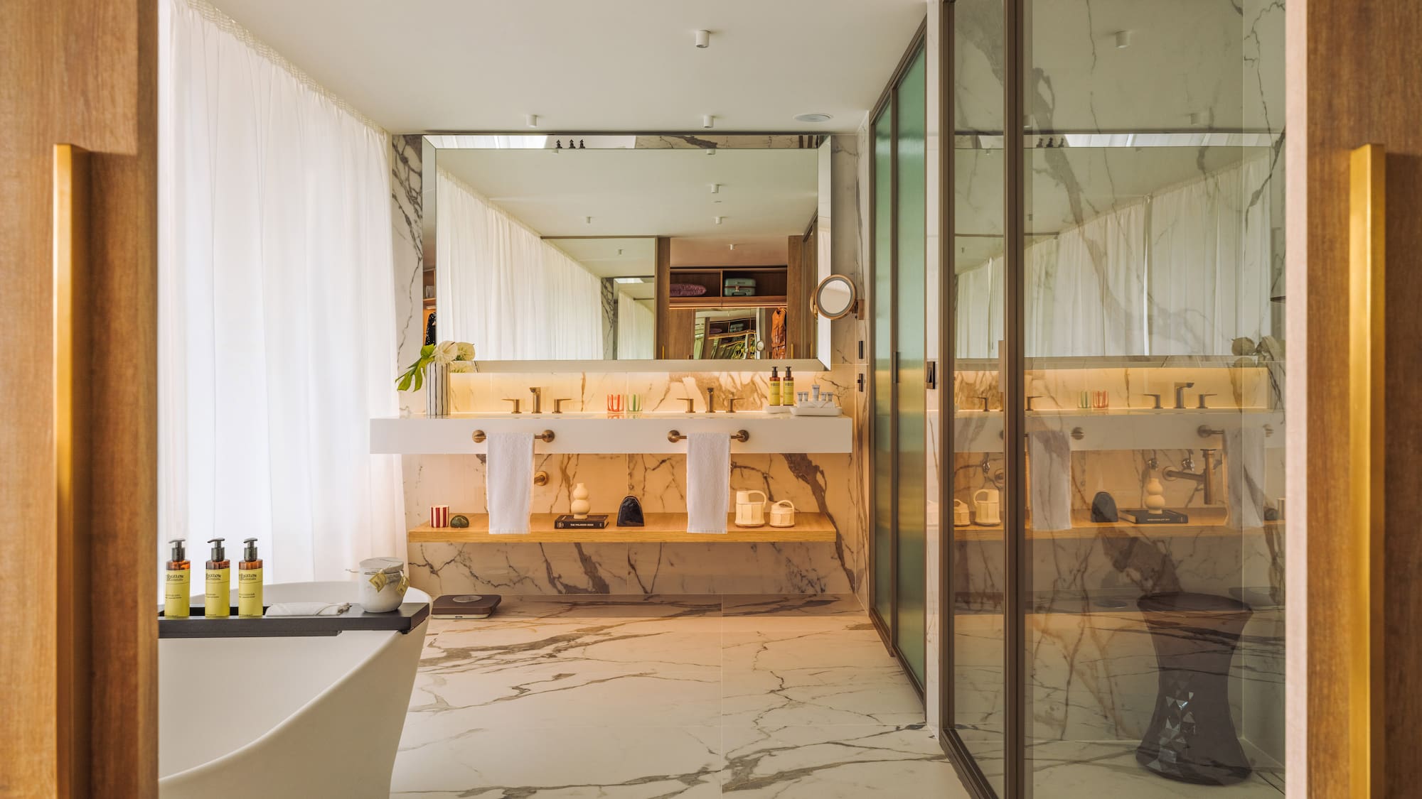 a bathroom with a tub and a shower