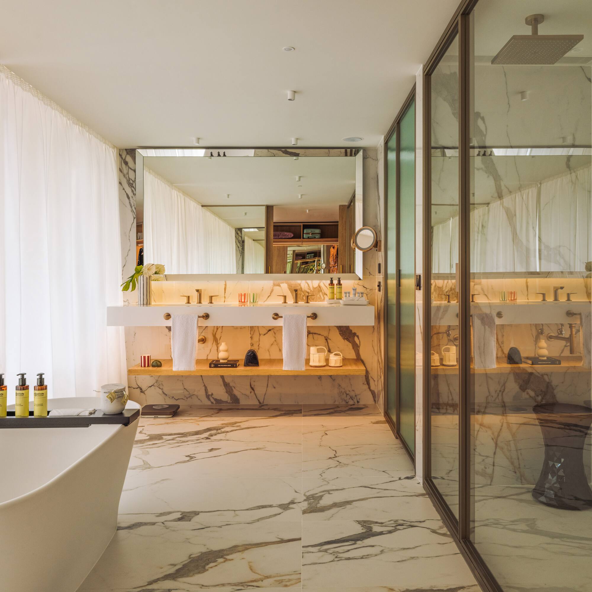 a bathroom with a tub and a shower