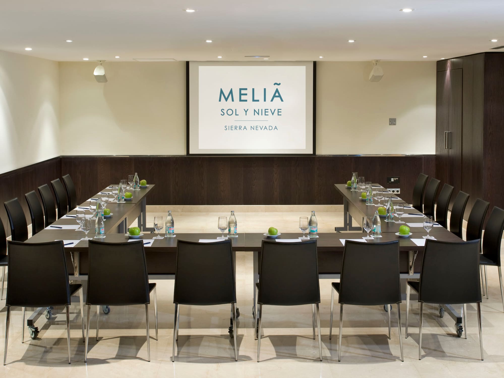 a conference room with a table and chairs