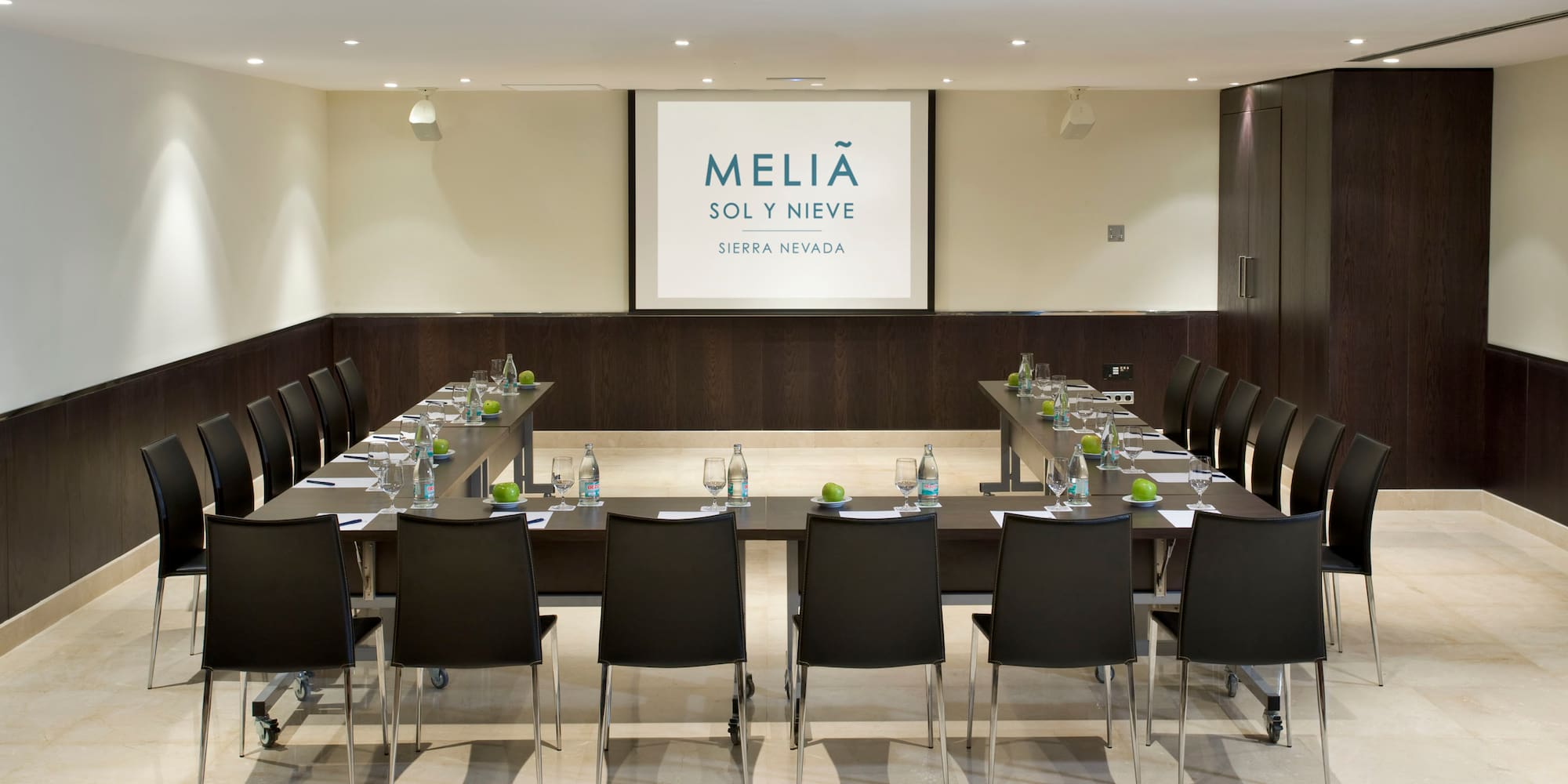 a conference room with a table and chairs