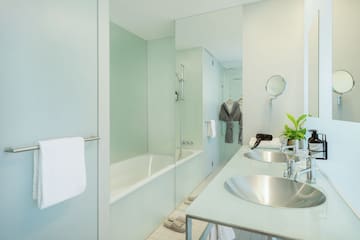 a bathroom with a bathtub and sink