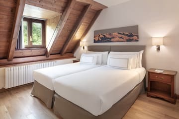 a bedroom with two beds