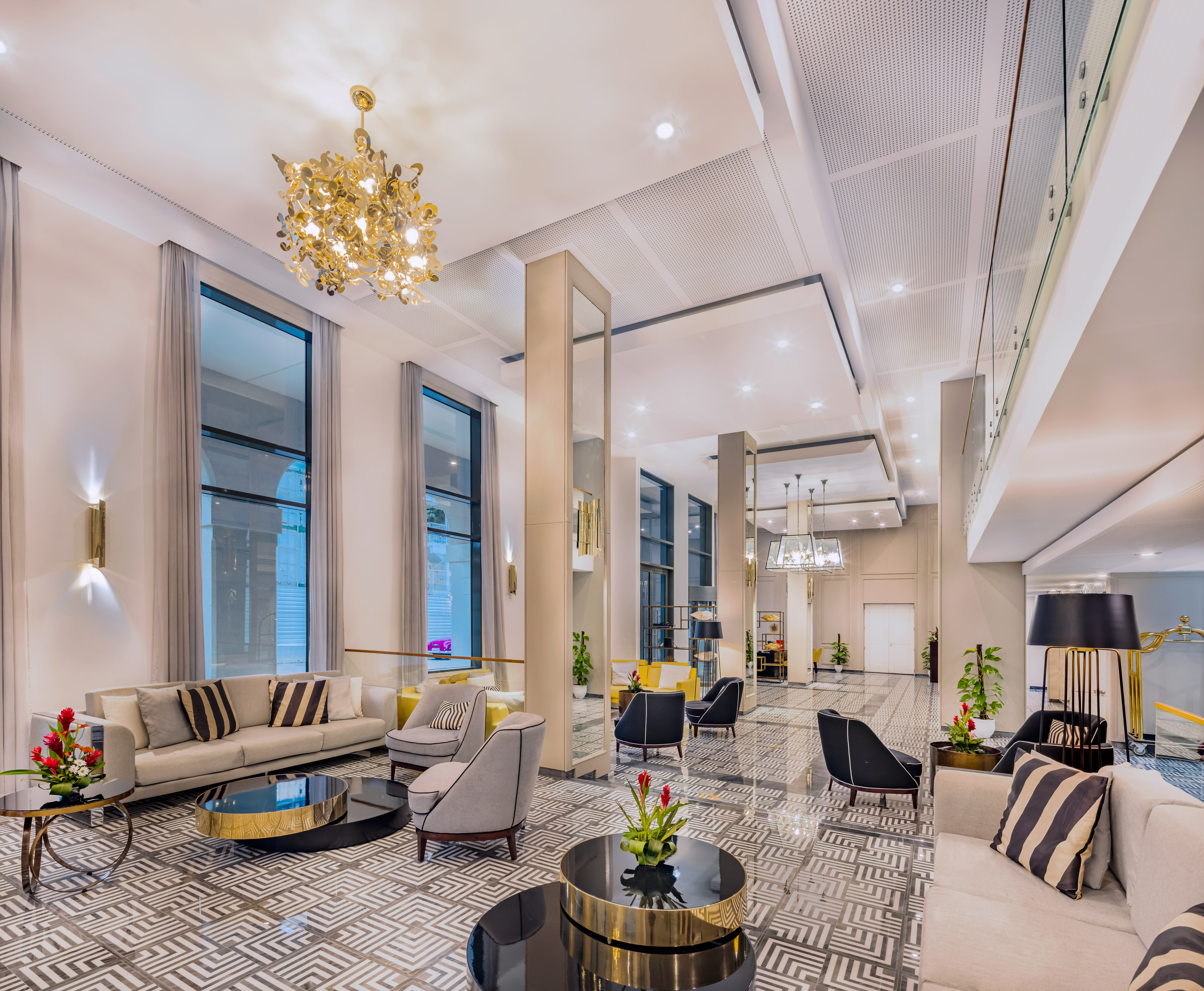 a large room with a chandelier and couches