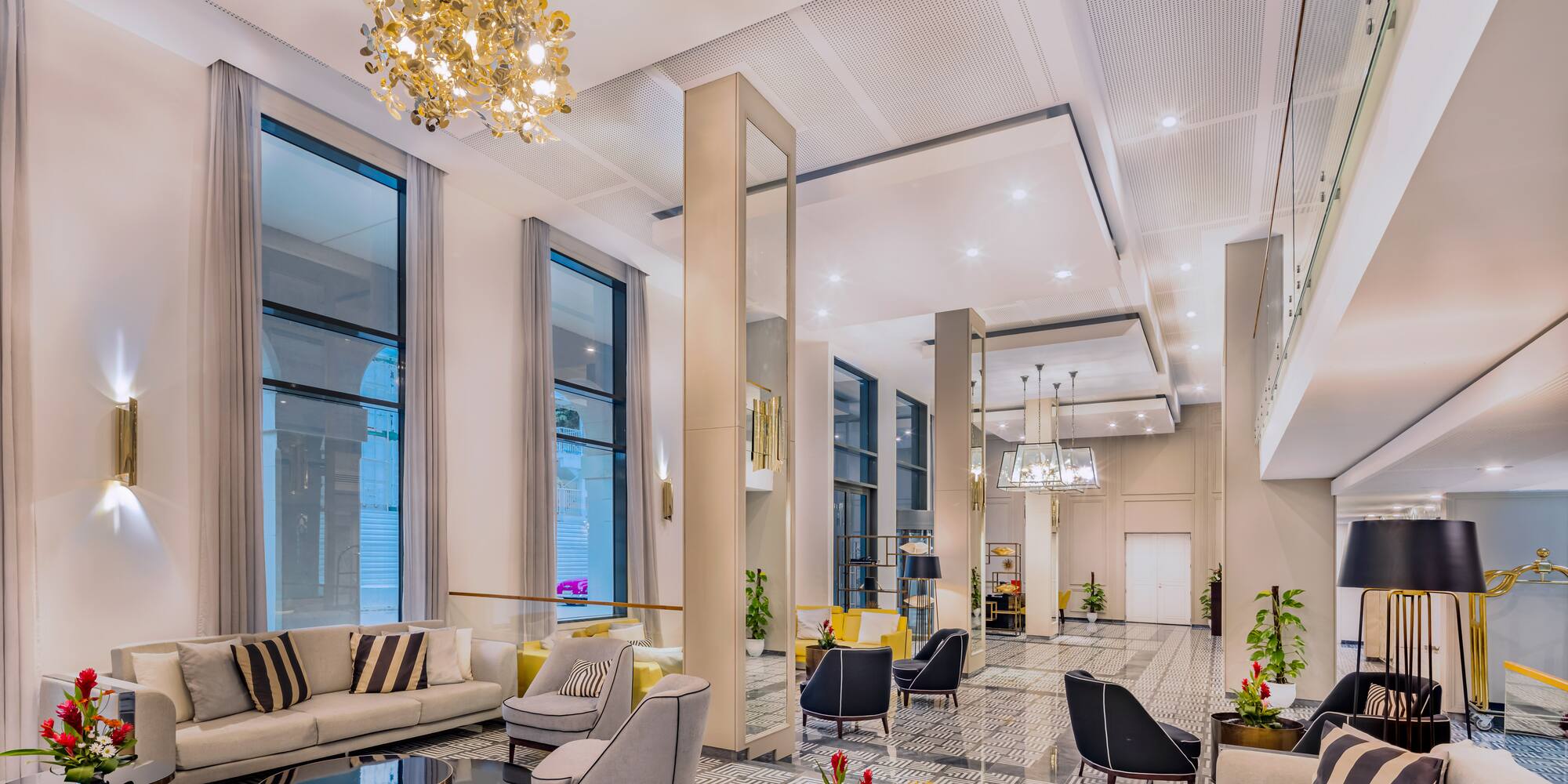 a large room with a chandelier and couches