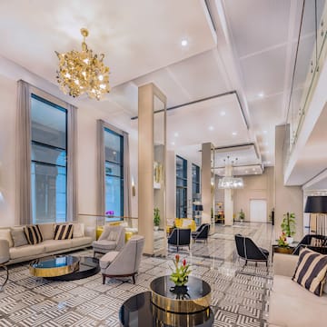 a large room with a chandelier and couches