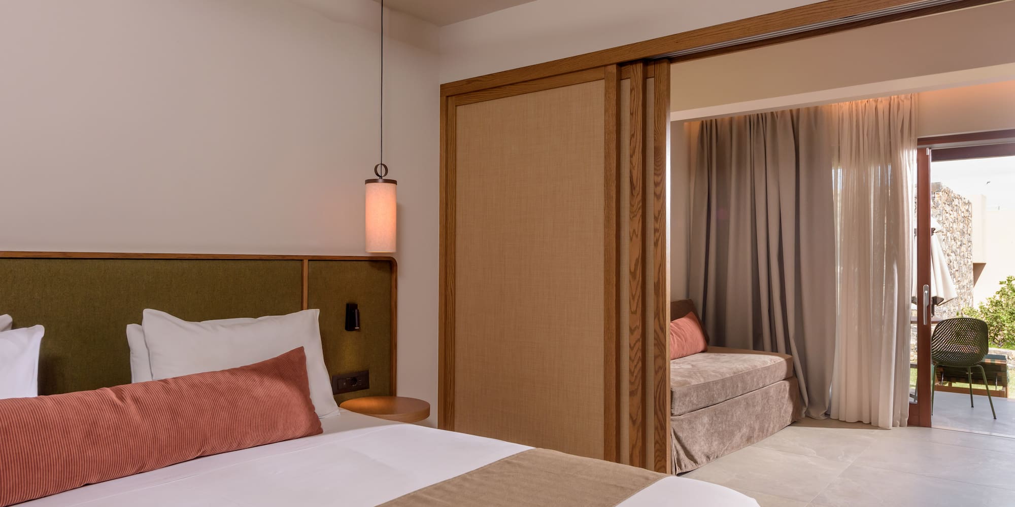 a bedroom with a bed and a sliding door