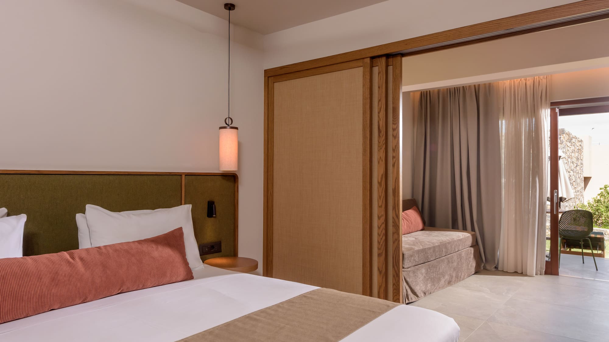 a bedroom with a bed and a sliding door