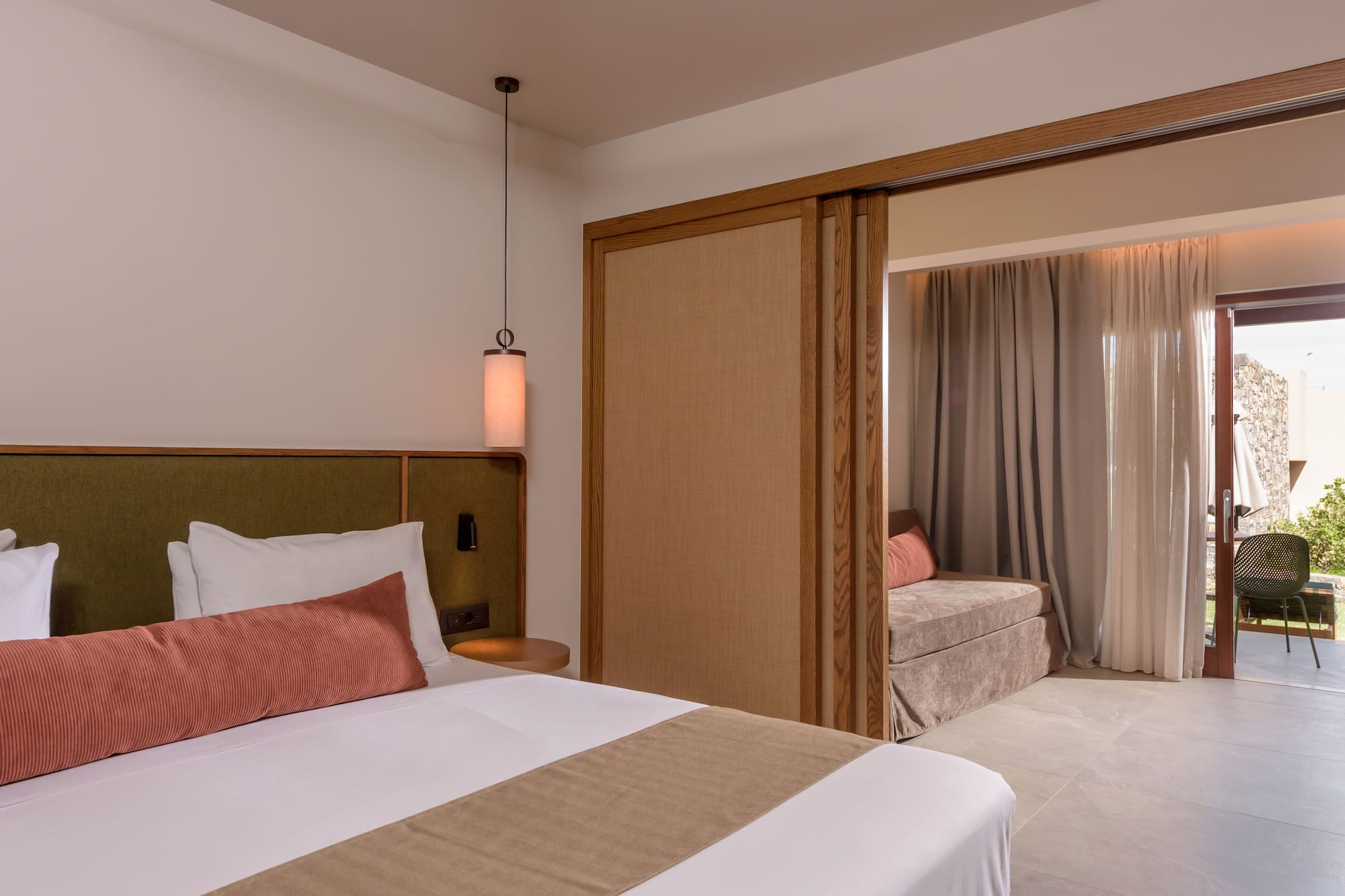 a bedroom with a bed and a sliding door