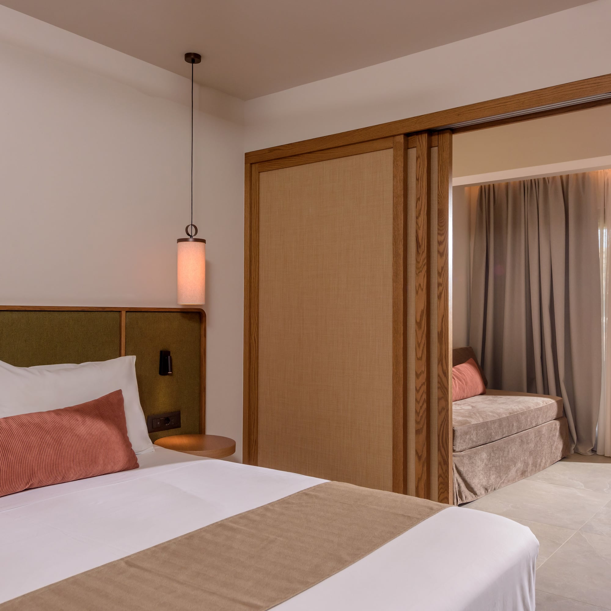 a bedroom with a bed and a sliding door